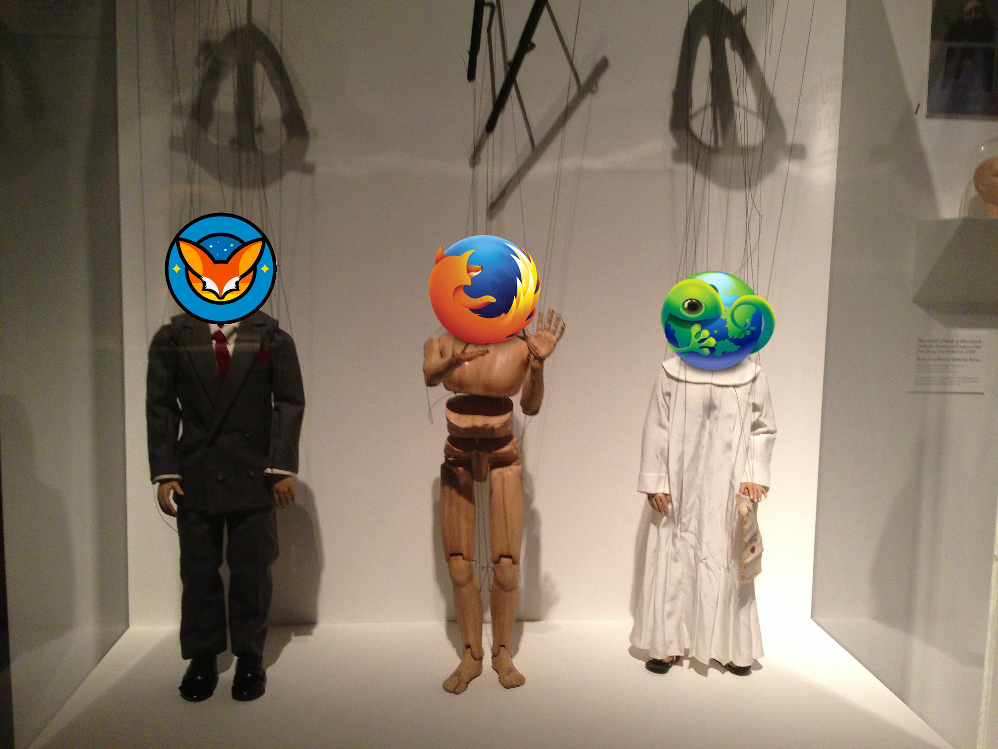 Picture of three marionette puppets with Fennec, Firefox, and B2G logos instead of heads